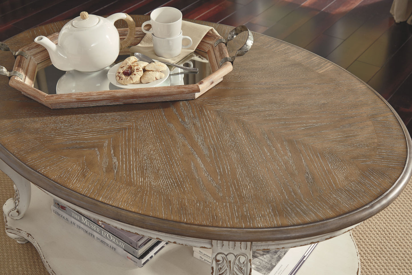 Realyn - White / Brown - Oval Cocktail Table